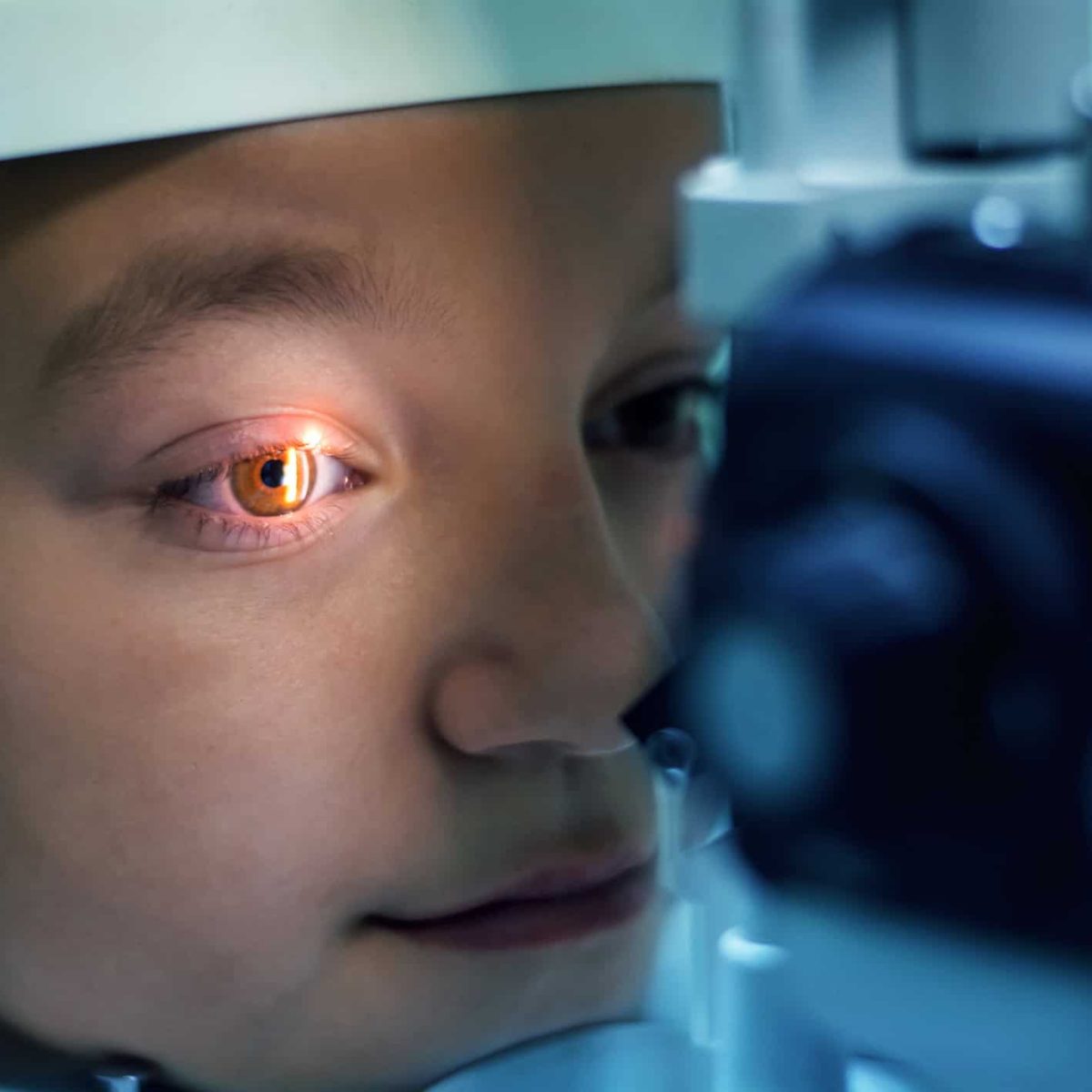 Optometrist performing visual field test